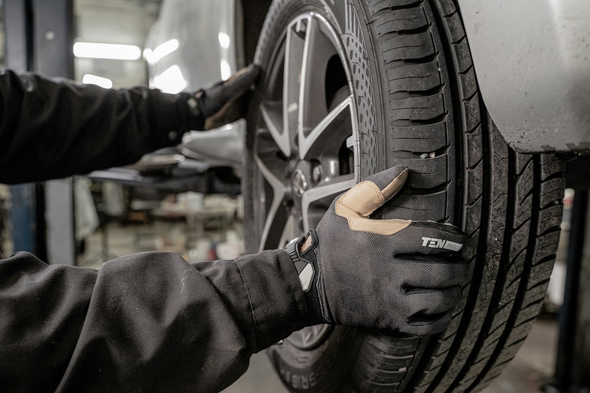 Person assembling a car tire